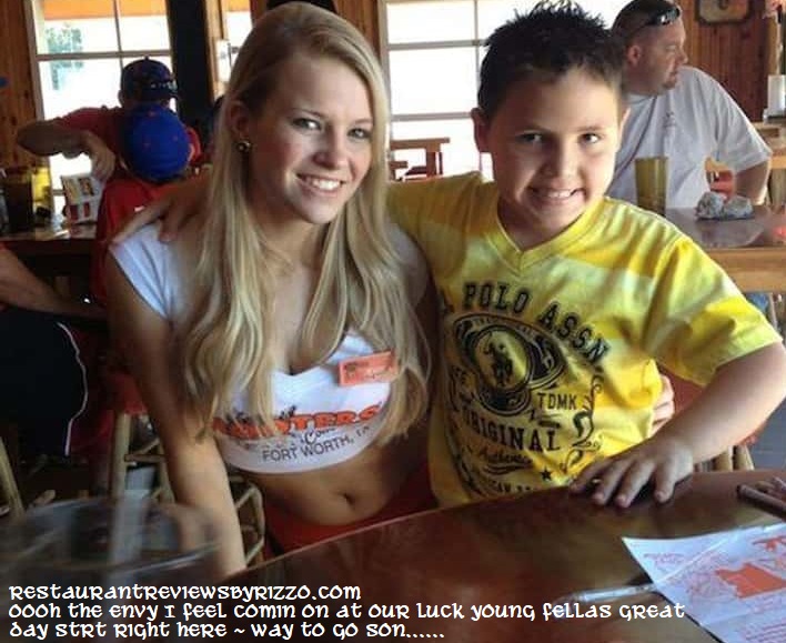 lucky young boy at hooters having just great fun